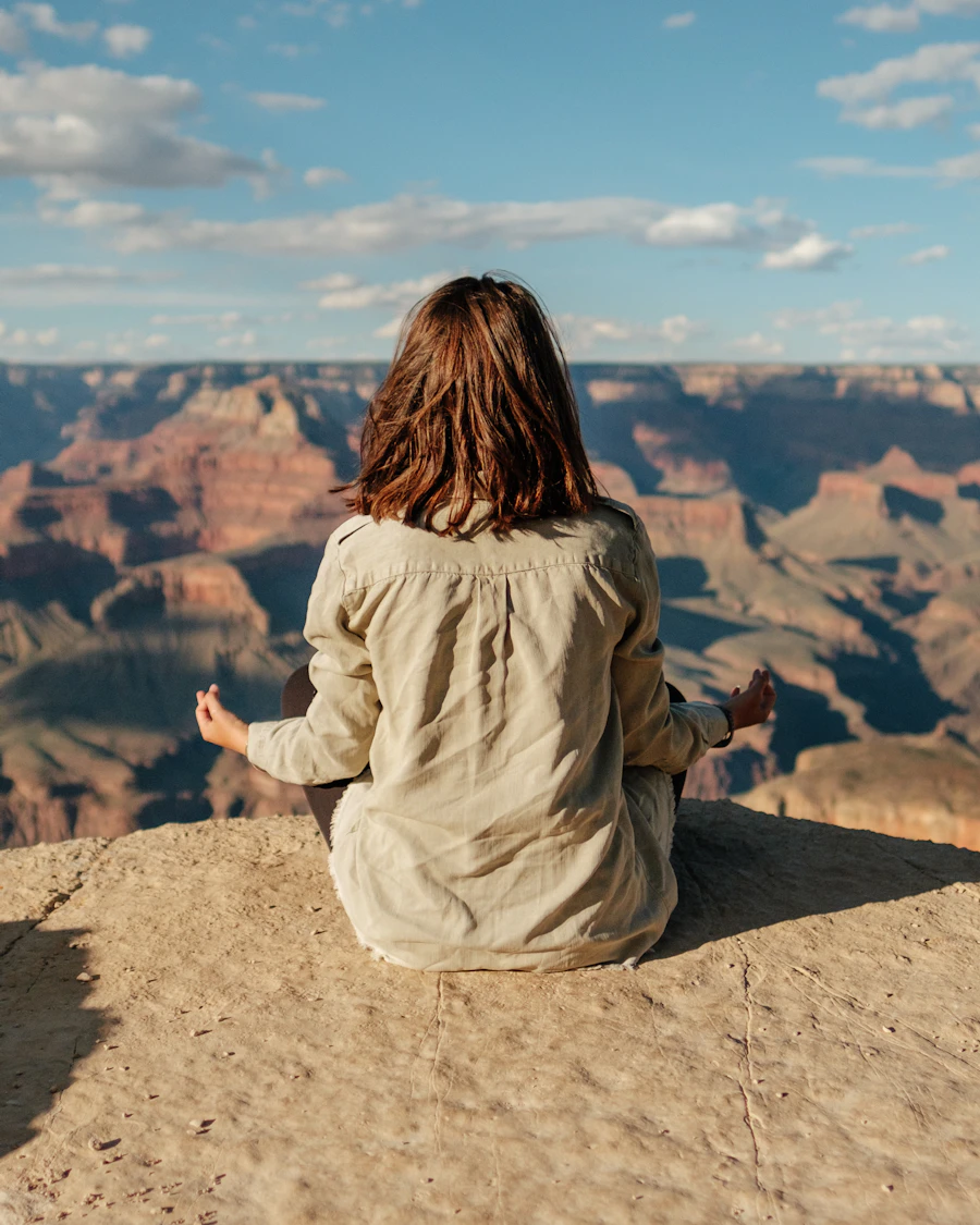 Meditating at the edge of a canyon